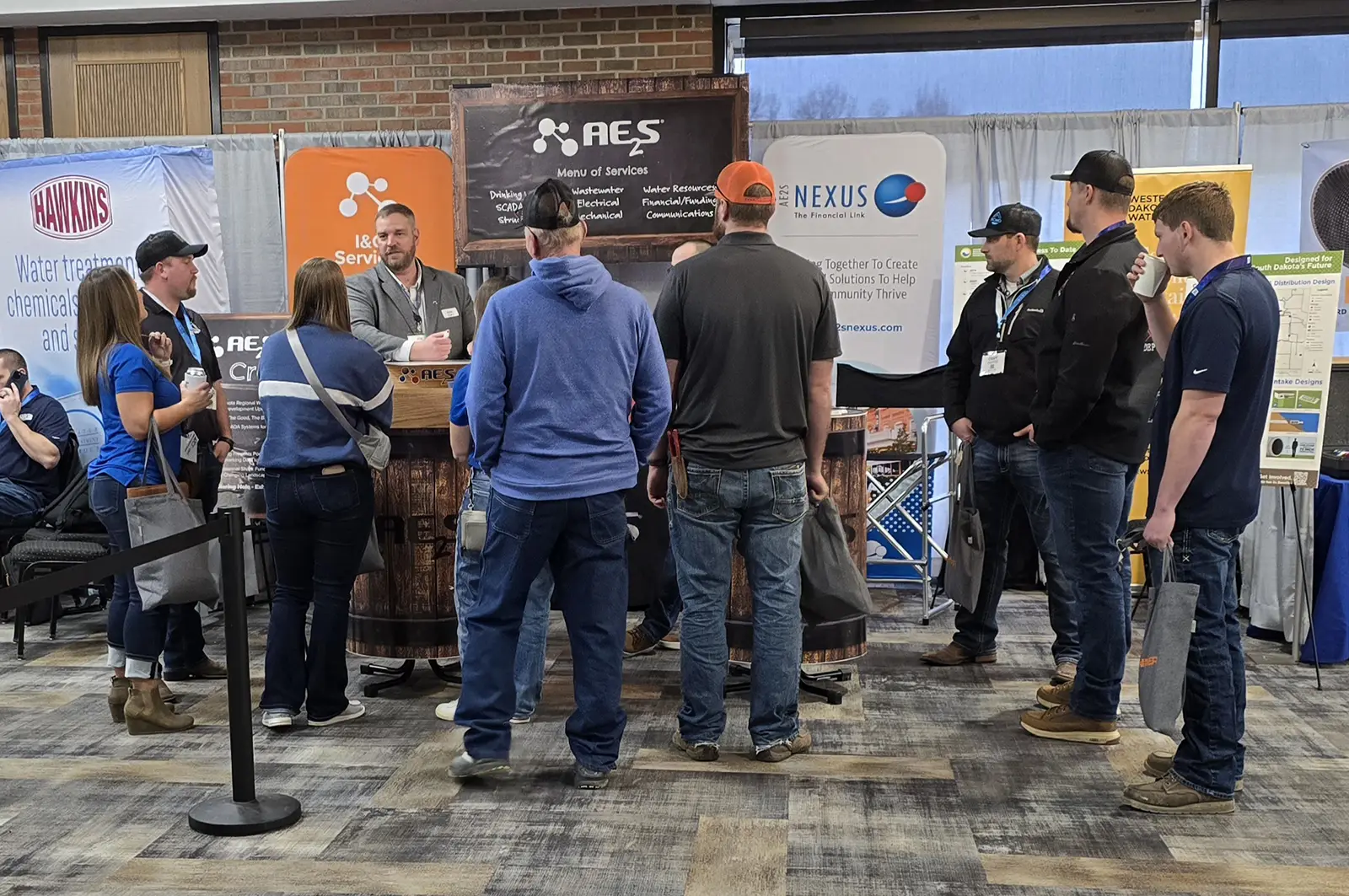 Photo of a group of people at the AE2S booth